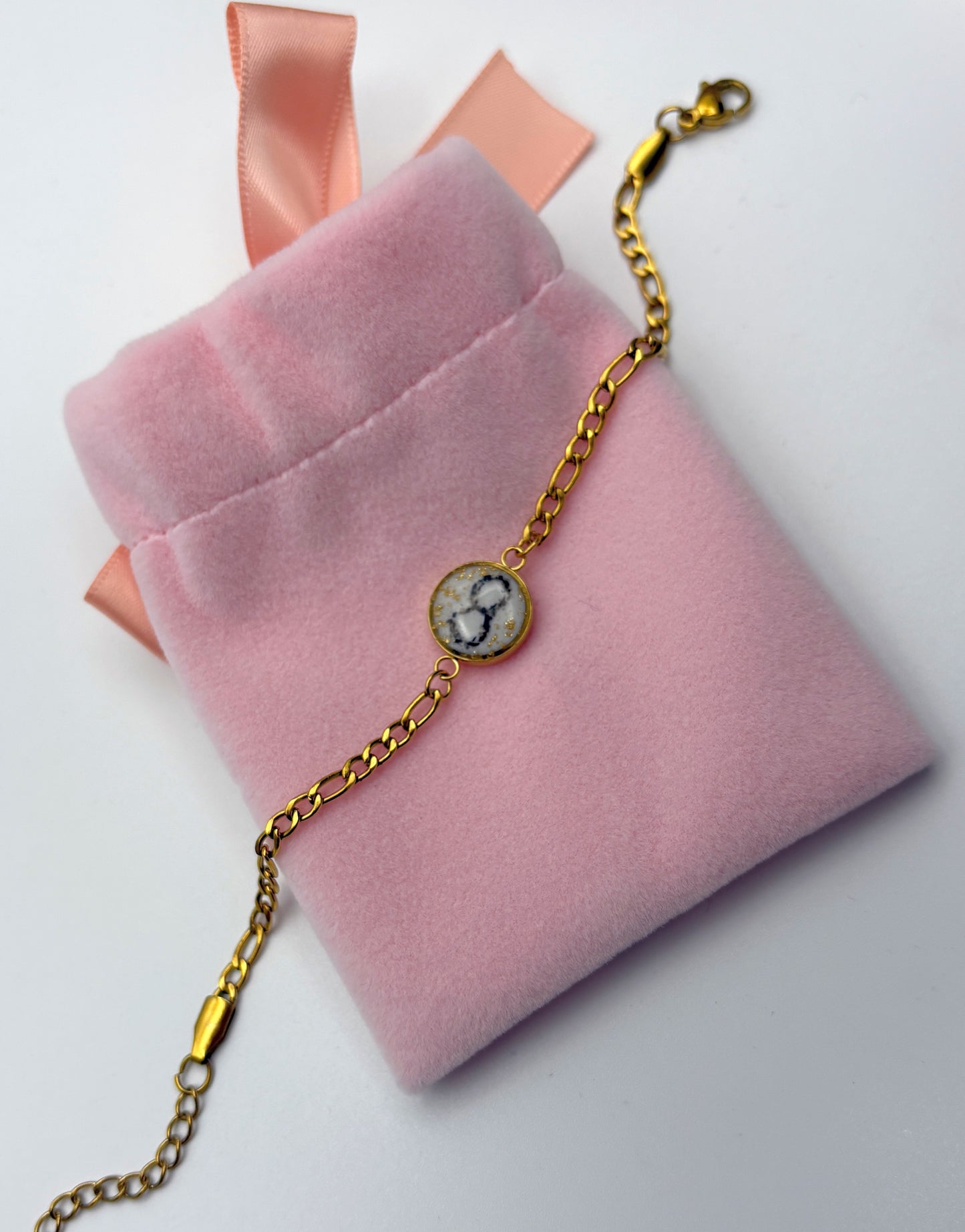 Stahl Armkette mit Tierkralle oder Nabelschnur als Infinty